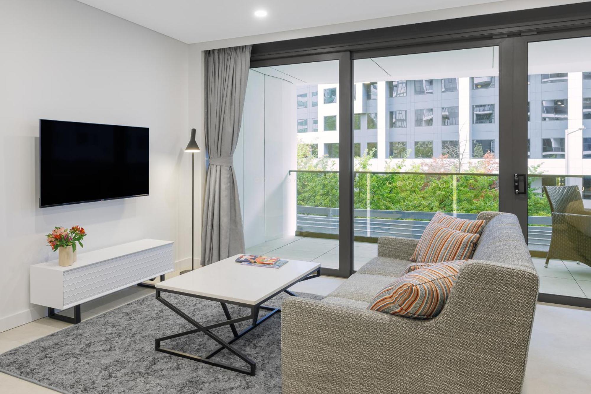 Meriton Suites Canberra Exterior foto Living room